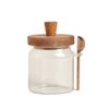 Tarro de vidrio con cuchara y tapa de madera
